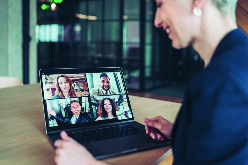 multi ethnic group of business persons having a video conference